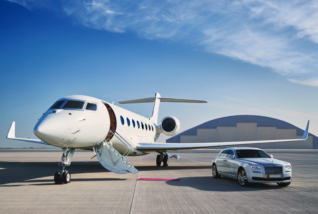 Private jet next to car