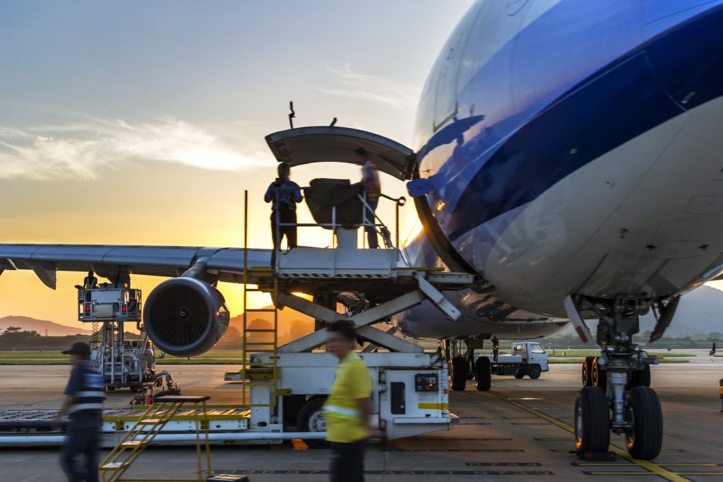 cargo plane loading at sunset