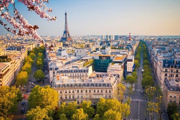 Overhead shot of Paris with the Eiffel tower in the background.