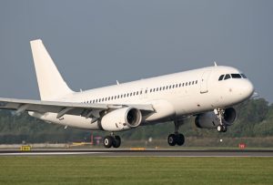 An A320 without a tail number landing.