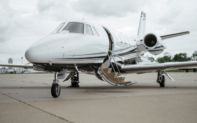 An image of a private jet, in an private terminal, ready for take off.