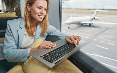 An image of a woman working in a business lounge.