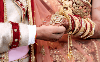 Bride and Groom at an Indian wedding holding hands