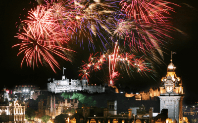 Edinburgh Castle fireworks display during Hogmanay; consider a private jet charter for a premier experience at the 2025 Edinburgh Festivals.